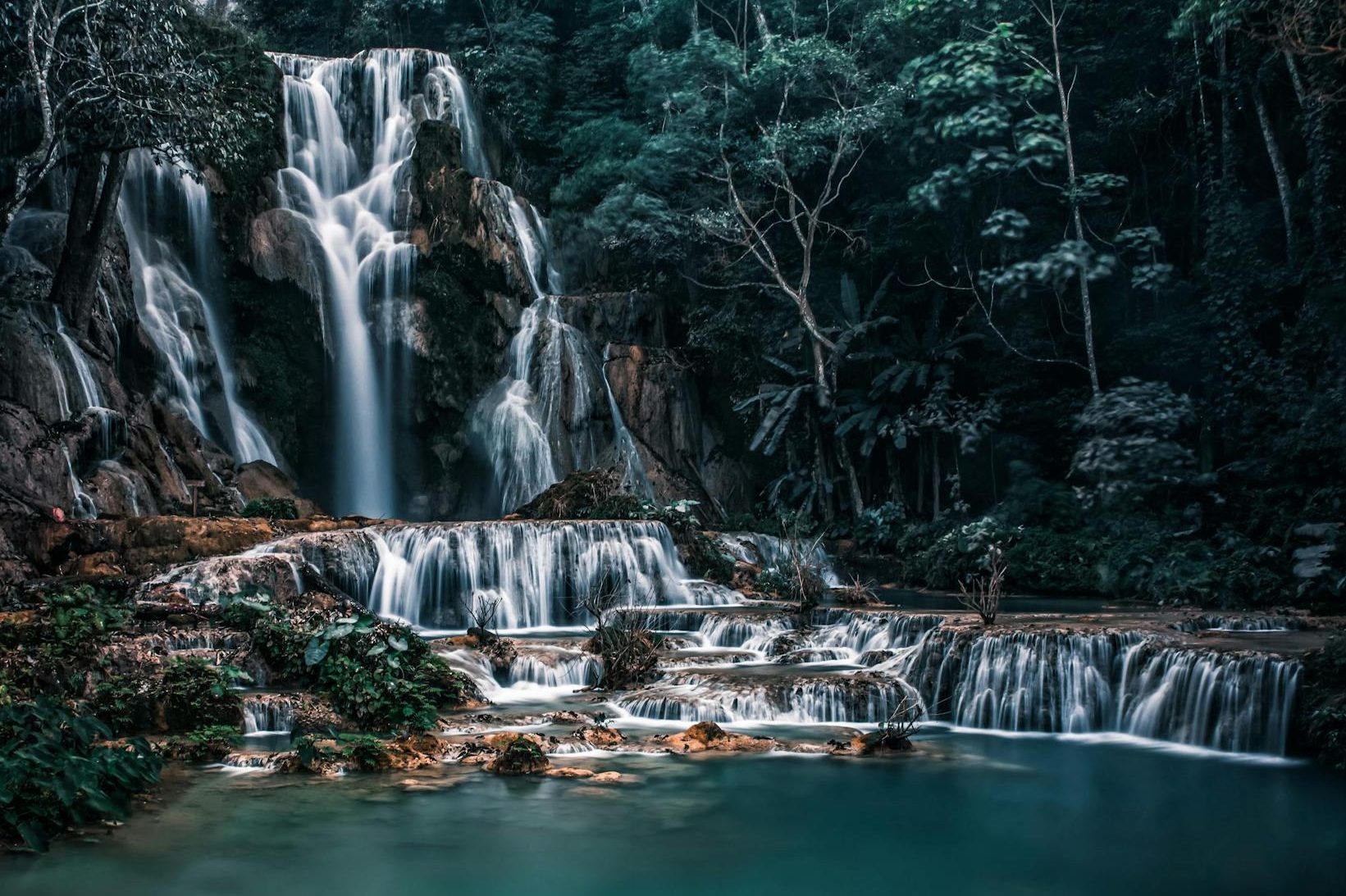 Waterfall ending in calm water. Photo by Max Mishin on Pexels.com